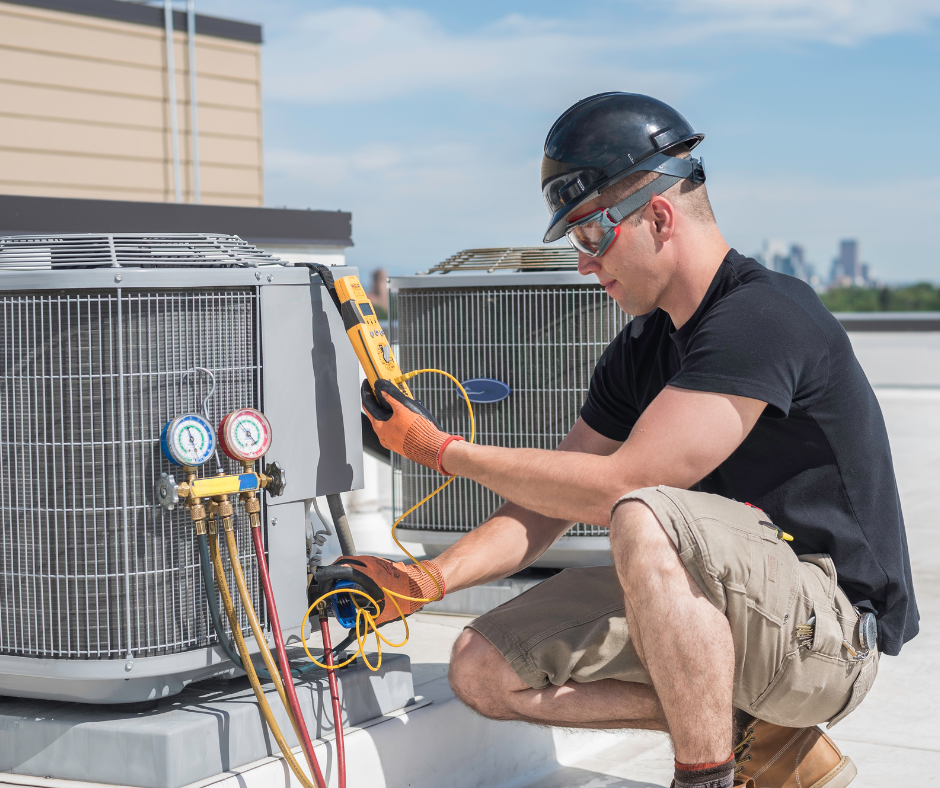 HVAC Repair Services -Technician at a unit on the roof - Best Price Maintenance