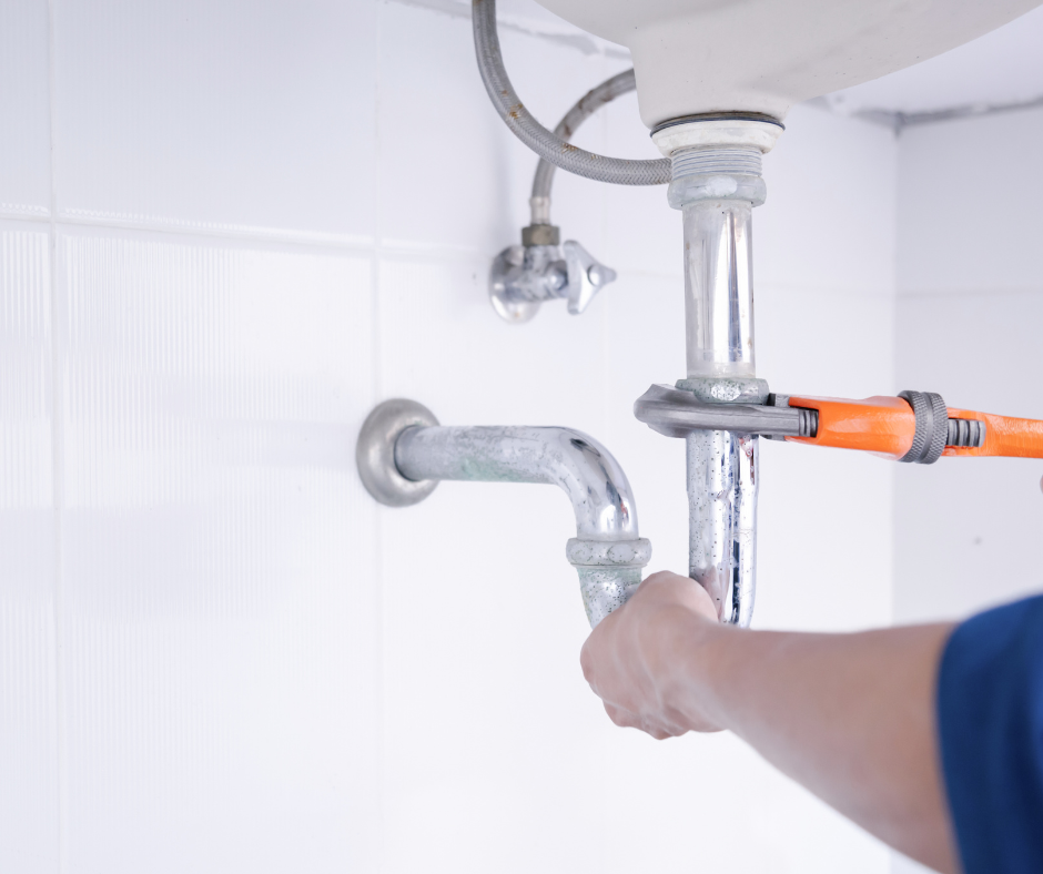 Plumbing Repair and Maintenance Services - Expert Plumber Repairing a Sink Drain - Best Price Maintenance